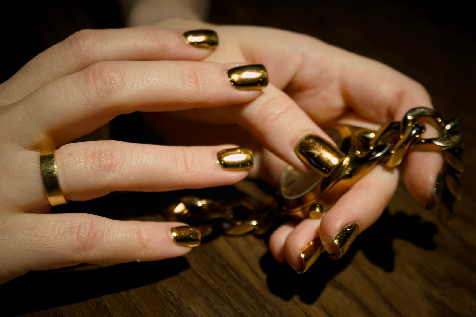 woman-is-holding-gold-instrument-with-gold-glitter-it